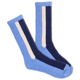 A pair of men's ski socks with blue color blocks and white stripes on a white background. thumbnail