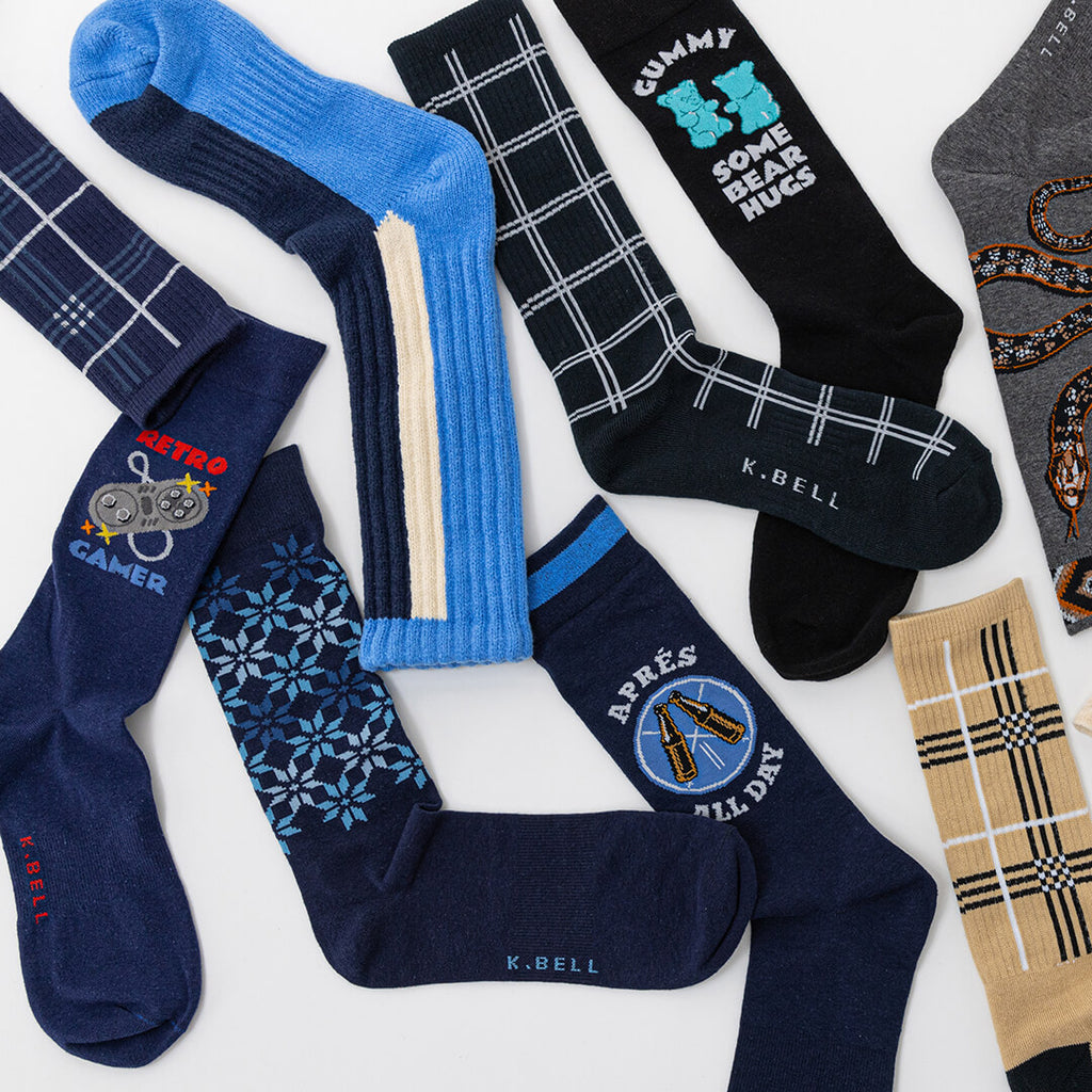 Collection of various socks with different designs and text on a white background