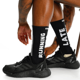 Person wearing black running shoes and socks with text on a white background thumbnail