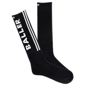 A pair of black crew socks with the word 'Baller' written in white on the side, featuring reflective logo, arch support, and cushioned sole.