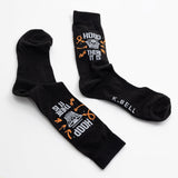 Black socks with text and graphics on a white background
