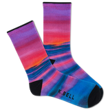 Two people wearing matching outfits with colorful socks in a casual setting. thumbnail