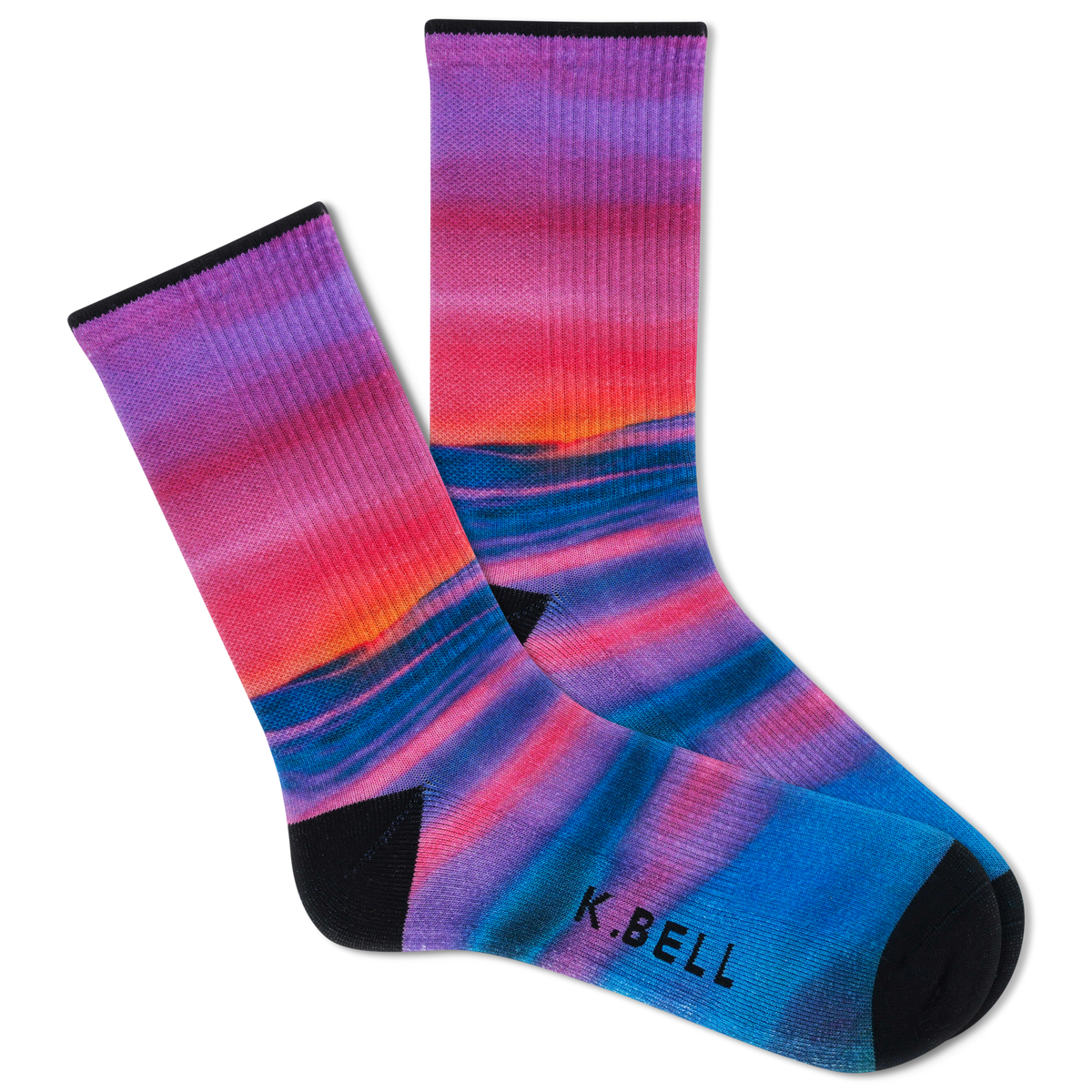 Two people wearing matching outfits with colorful socks in a casual setting.