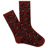 A pair of red boot crew socks with a leopard print pattern. thumbnail