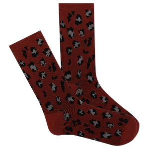 A pair of red boot crew socks with a leopard print pattern.