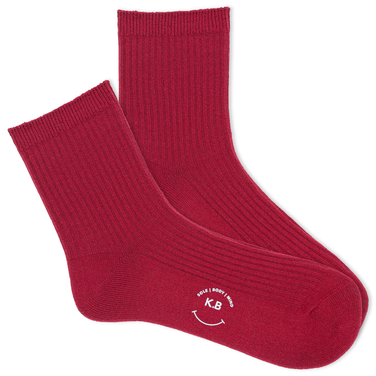A pair of red ribbed ankle socks with the brand name 'K.Bell' displayed on the foot area.