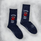 Navy socks with 'Apèrs All Day' text and graphic on a snowy background