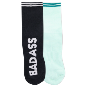 Two ankle socks, one black and one white, with the word 'BADASS' written across the cuffs and a reflective logo on the black sock.