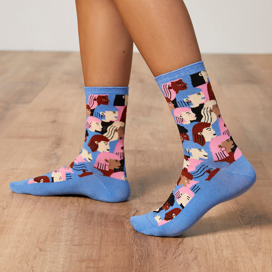 Colorful patterned socks on a wooden floor