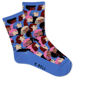 Pair of socks with a colorful pattern of faces on a blue background, featuring the brand 'K. Bell'.