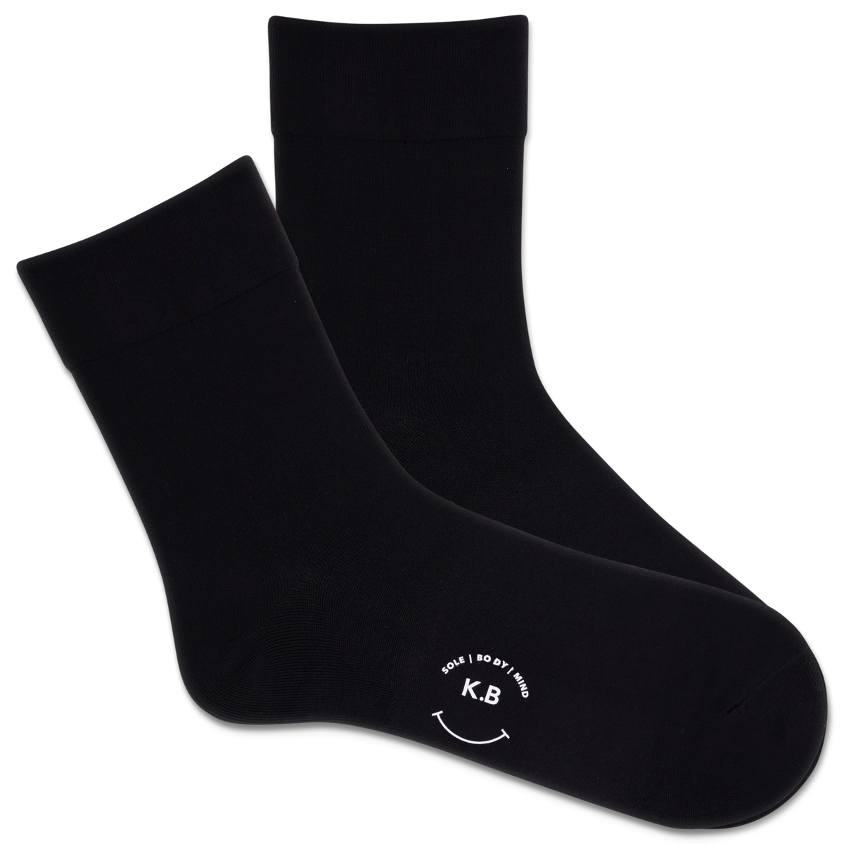 Black socks with a smiley face and initials on a white background