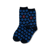 Person wearing blue patterned peace sign socks on a white floor.