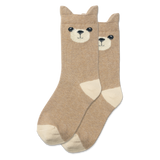 Child sitting in a hammock wearing socks with bear faces.